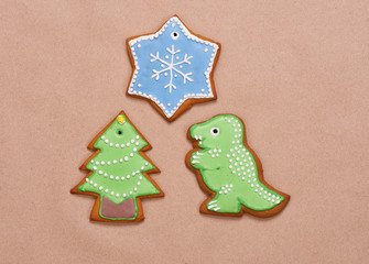 Gingerbread cookies for Christmas on a brown background