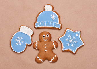 Gingerbread cookies for Christmas on a brown background