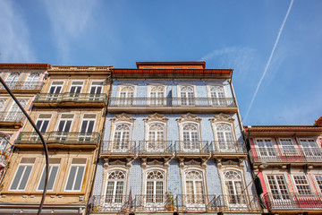 View on the beautiful old building facades with famous portuguese tiles on the street in the old town of Porto city, Portugal