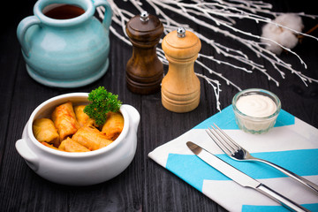Stuffed cabbage leaves with minced meat and rice in tomato sauce