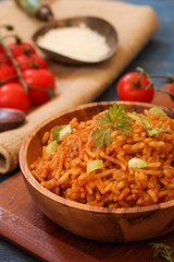Home cooked Spanish rice served in a wooden bowl, selective focus