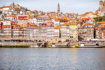 Fototapeta na wymiar Landscape view on the riverside with beautiful old buildings in Porto city, Portugal