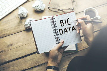 woman written big data text on notepad