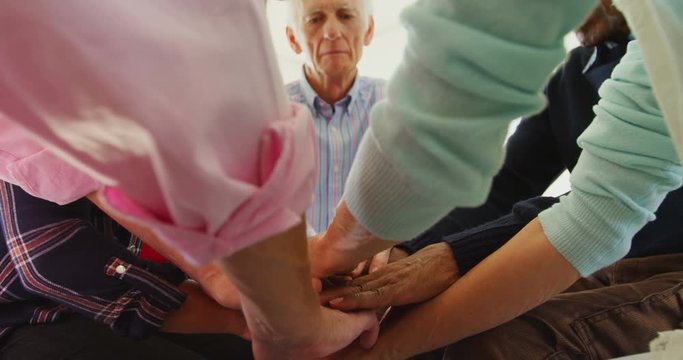 Group of people forming handstack 