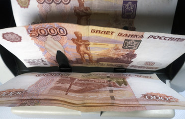 electronic money counter machine is counting the Russian five-thousandth ruble banknotes..