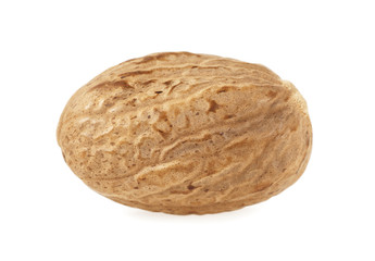 Nutmeg isolated on a white background, macro shot