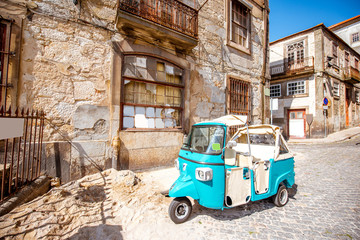 Old tourist motorbike on the street in Porto city, Portugal - obrazy, fototapety, plakaty