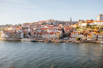 Landscape view on the old town on the riverside of Douro river in Porto during the sunset in Portugal