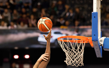 scoring during a basketball game - ball in hoop - Powered by Adobe