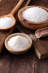 Fototapeta na wymiar differnt kind of salt in wooden bowl and spoon.