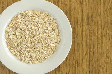 White dish with raw oat
