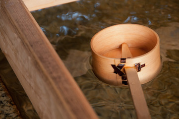 Wooden dipper of holy zen water in Japan Shinto temple