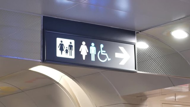 Motion of man, woman and disable washroom logo on wall with 4k resolution