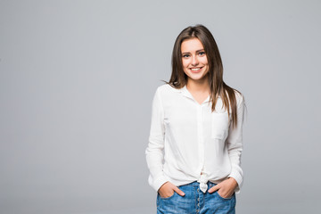 Close up portrait of a woman standing against gray background