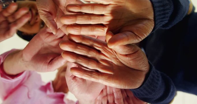 Group of people forming handstack 