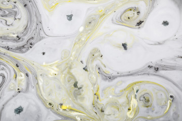 Closeup abstract color mixing of acrylic for use as background. Acrylic texture with marble pattern, marbling background 