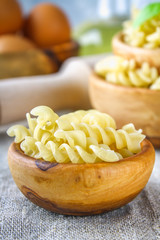 Helix- or corkscrew-shaped pasta. Rotini macaroni. Related to fusilli, but has a tighter helix, i.e. with a smaller pitch.