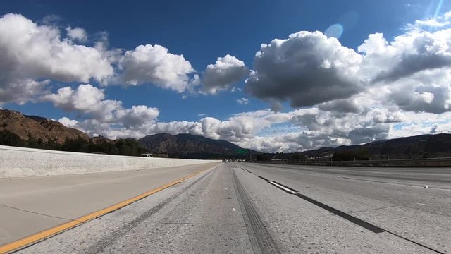 Slow motion driving shot in the fast lane on the 210 freeway in Los Angeles, California.