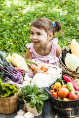 Lovely girl plays with vegetables