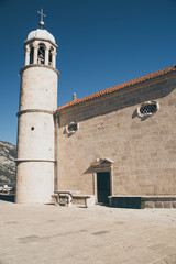 Old stone church tower in sunny Europe island