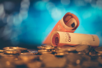 European money, economic charts in the background. The concept of saving, making money. Variously...