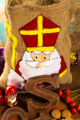 Traditional Dutch Saint Nicolas celebration with presents for children in December, Saint Nicolas  gift bag and chocolate letters