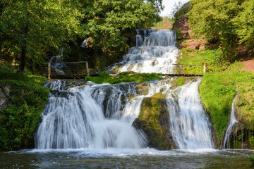 Fototapeta na wymiar Chervonogorodsky, Dzhurynsky waterfall in Nyrkiv on the Dzhuryn river. Ternopilska oblast, Ukraine.