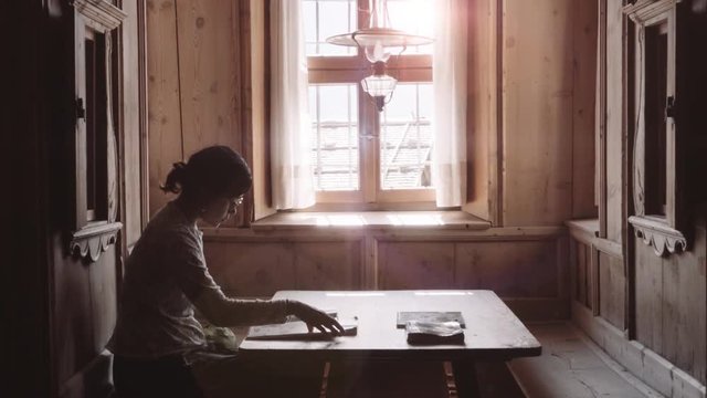 Woman  alone reading in beautiful  library made of wood. 4k
