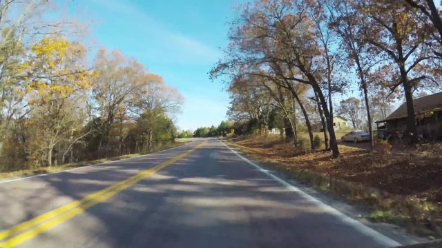 Branson MO,USA - November 10, 2017. POV. point view of autumn colors on a Branson road. Driving. Scenic view from car.