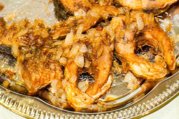 Dish from pieces of fried river fish for dinner in Russia