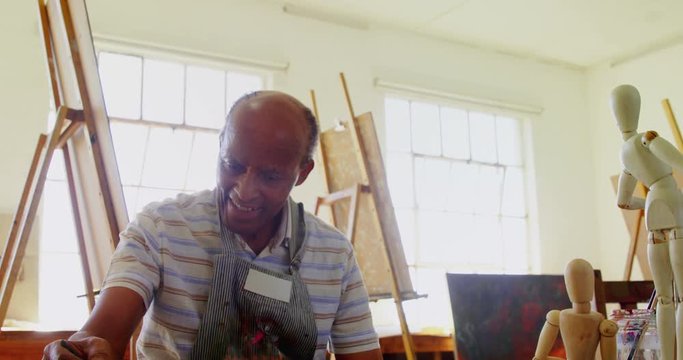 Artist drawing sketch at table 