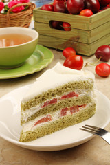 Slice of delicious cherry tomato cake on white plate.