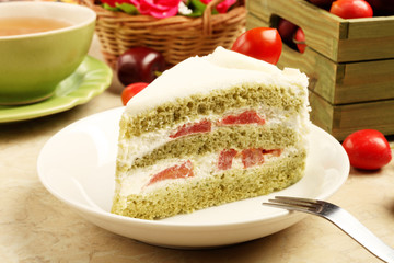 Slice of delicious cherry tomato cake on white plate.