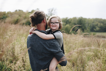 Caucasian dad having fun with daughter