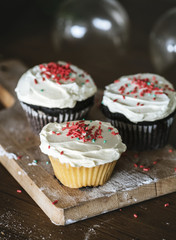Three cupcakes with buttercream frosting