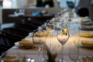 Empty glasses wine in restaurant. Glass water. Dish spoon fork on table