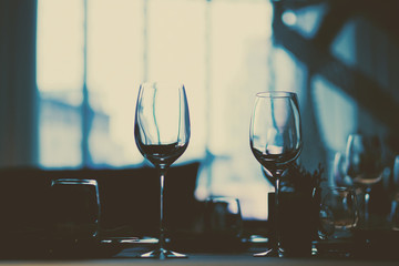 Empty glasses wine in restaurant. Glass water. Dish spoon fork on table