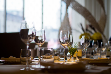 Empty glasses wine in restaurant. Glass water. Dish spoon fork on table