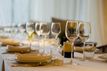 Empty glasses wine in restaurant. Glass water. Dish spoon fork on table