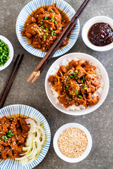 fried pork with spicy korean sauce (bulgogi) on top rice