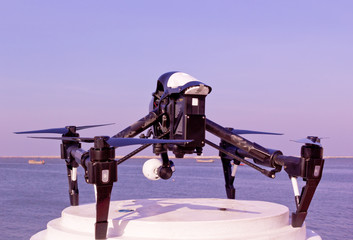 Professional camera drone and ocean.