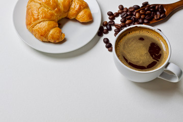 Coffee cup and croissant breakfast in the morning 