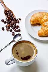 Coffee cup and croissant breakfast in the morning 