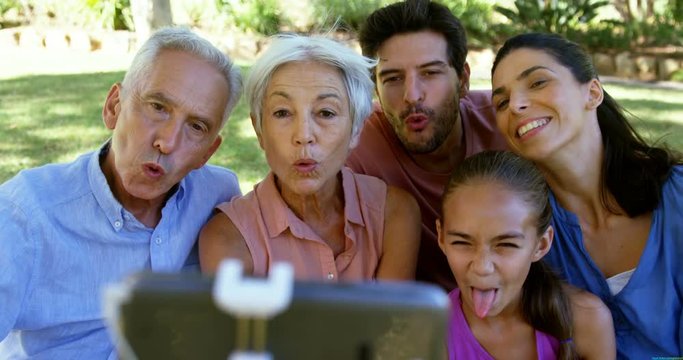 Family taking a selfie in the park 