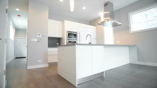 White modern kitchen in a house with a beautiful design