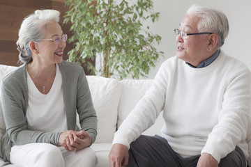 An old couple talking with each other happily