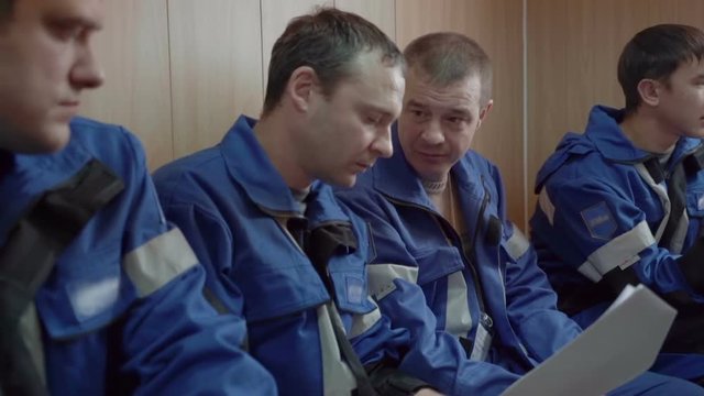 Workers are sitting in the recreation room slow motion