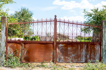 old rickety gates. Old rusty gate in an abandoned house. Broken gate.