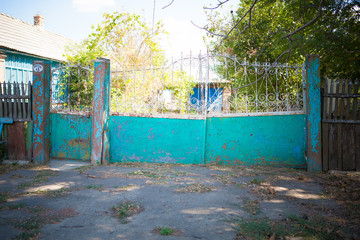 old rickety gates. Old rusty gate in an abandoned house. Broken gate.