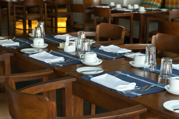 Glasses and plates on reserviert table in restaurant